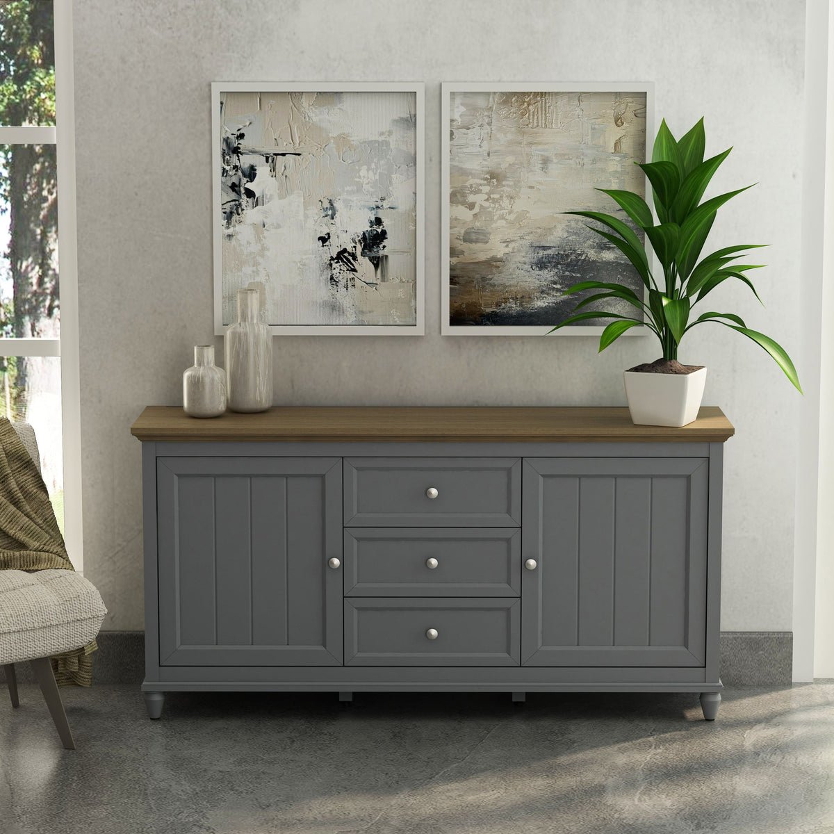 Gray sideboard with wooden top in a room with abstract art and a plant.