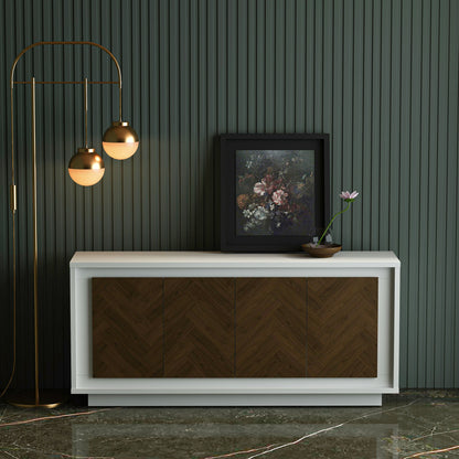Modern interior design with a white console table, wooden chevron pattern, and decorative elements against a dark green wall.