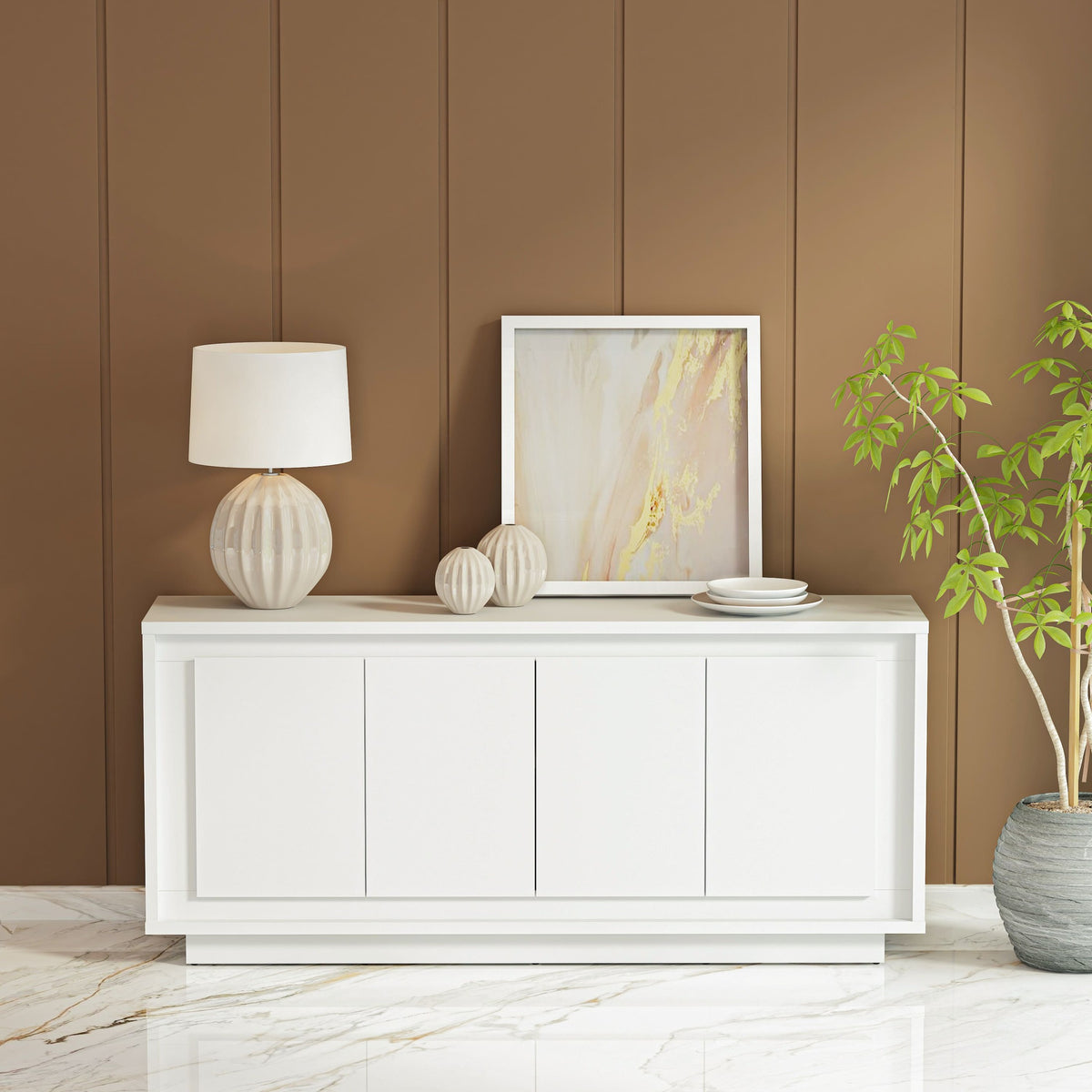 White sideboard with decorative items against a brown paneled wall