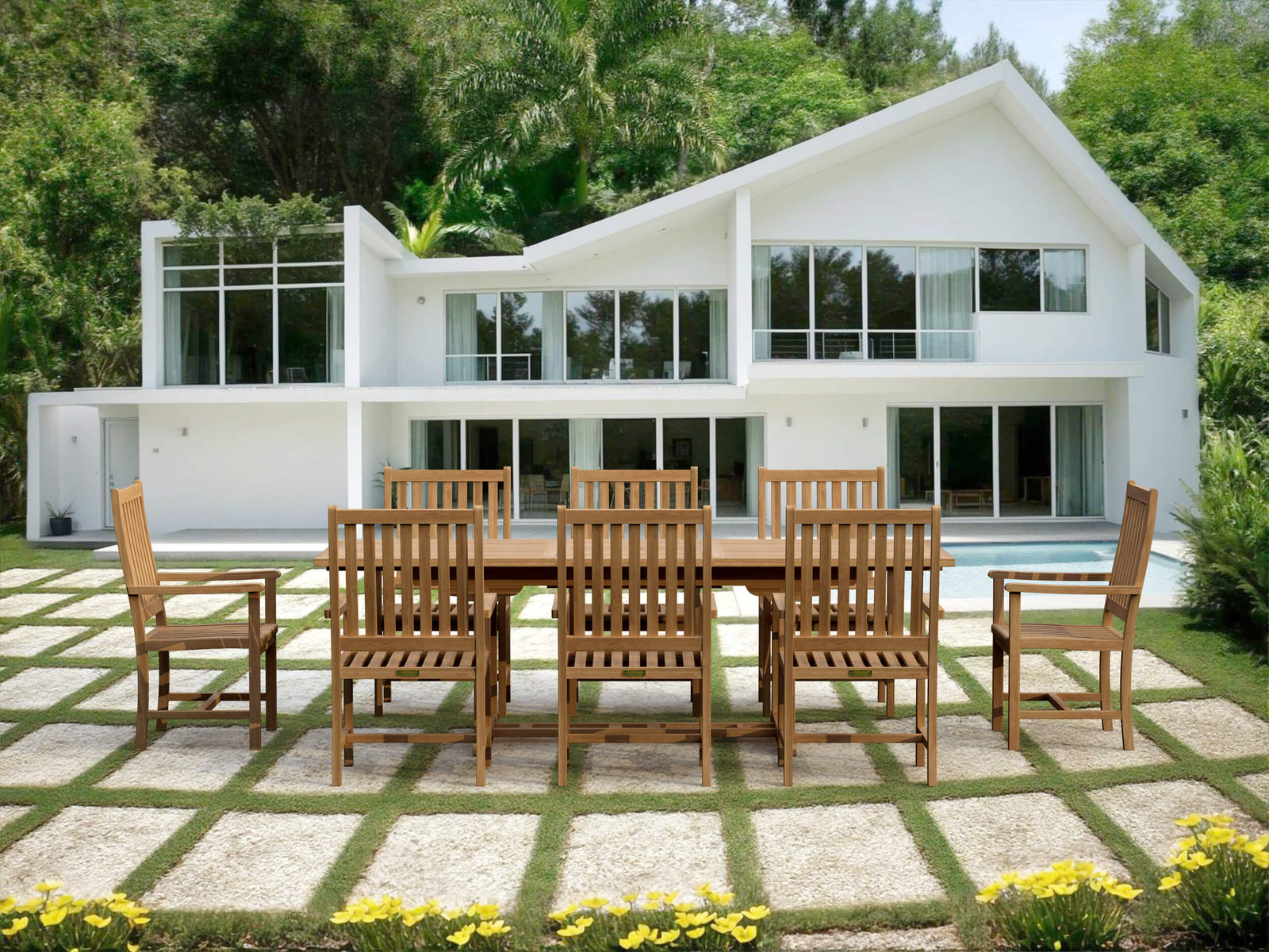 Wooden outdoor dining set on a patio in front of a modern white house.