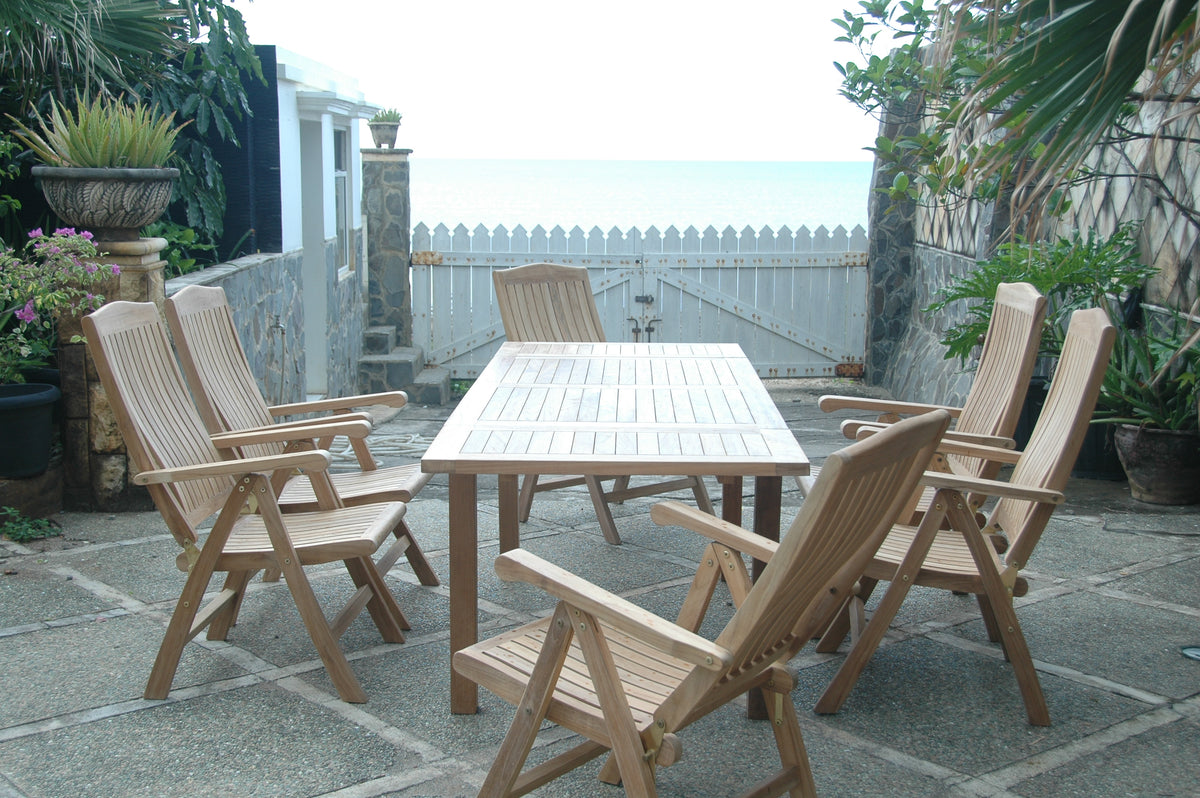 Wooden outdoor dining set with chairs on a stone patio