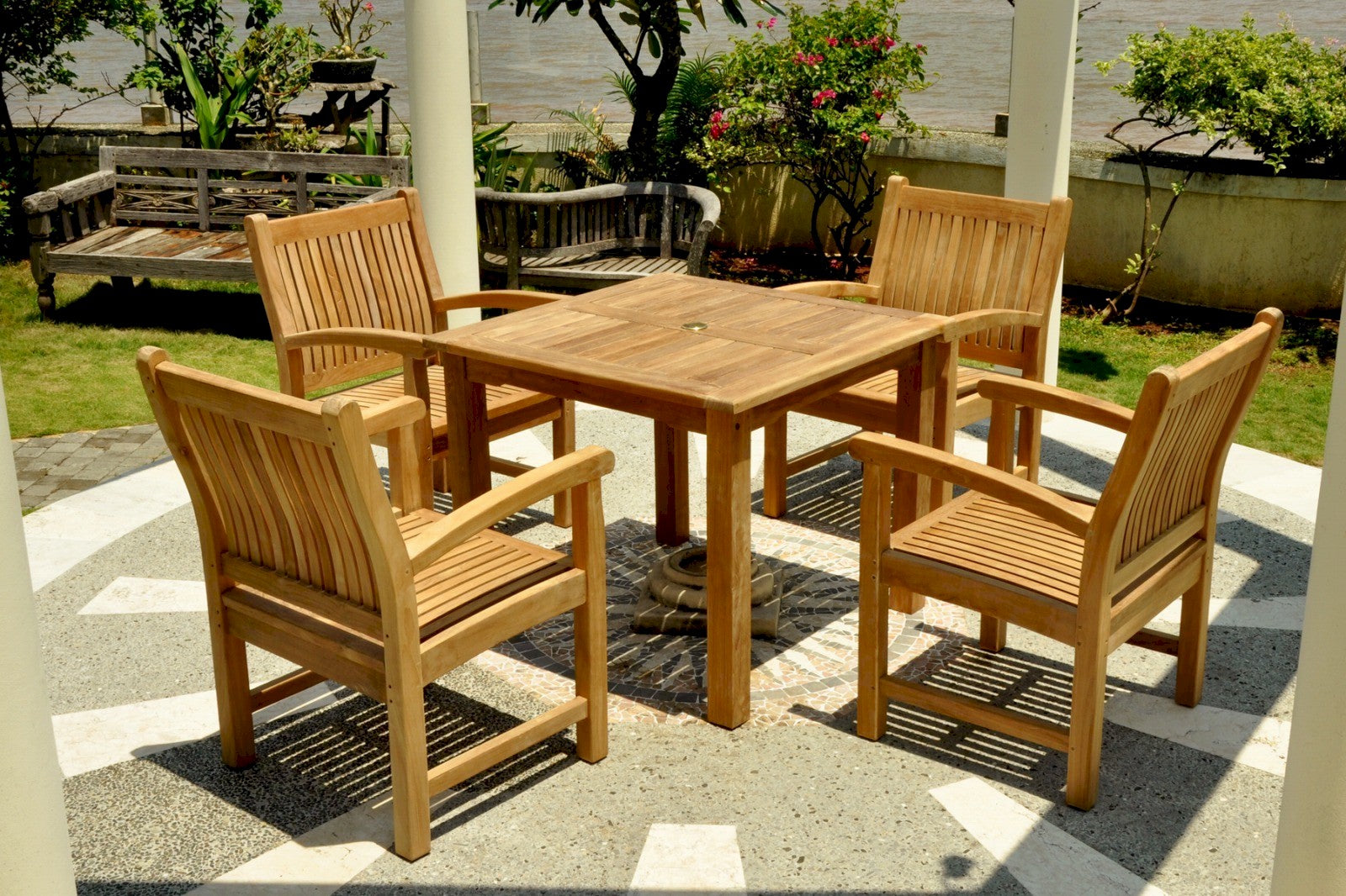 Wooden outdoor dining set with table and chairs on a patio