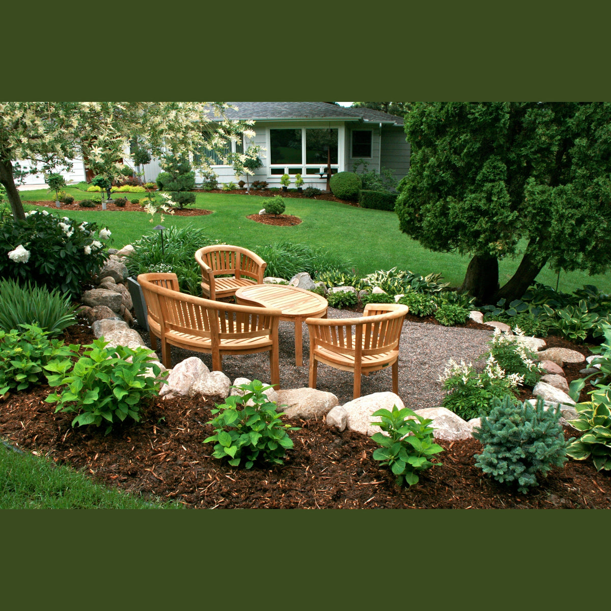 Outdoor garden setting with wooden furniture and landscaping
