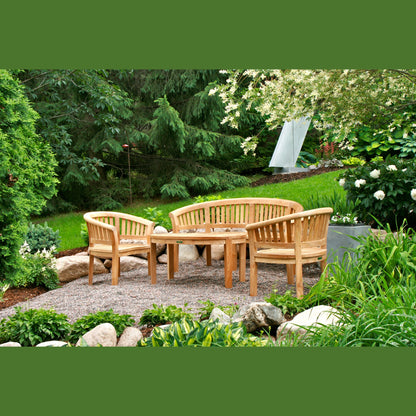 Wooden garden furniture set in a lush garden setting with trees and plants.