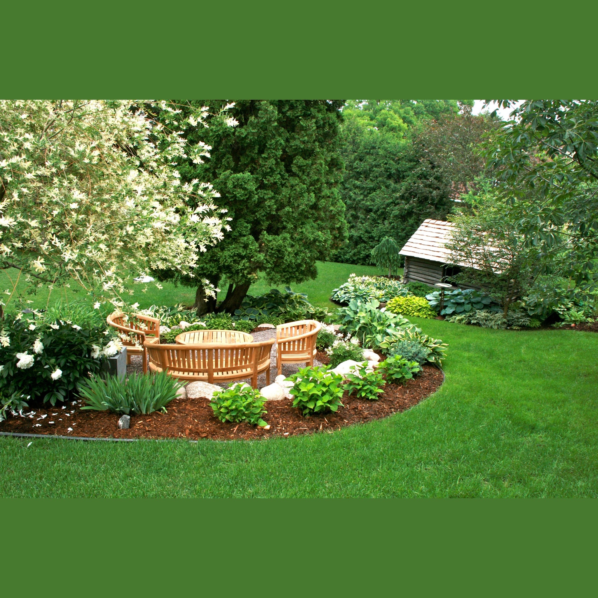 Garden with wooden bench, plants, and a small shed in a lush green setting.