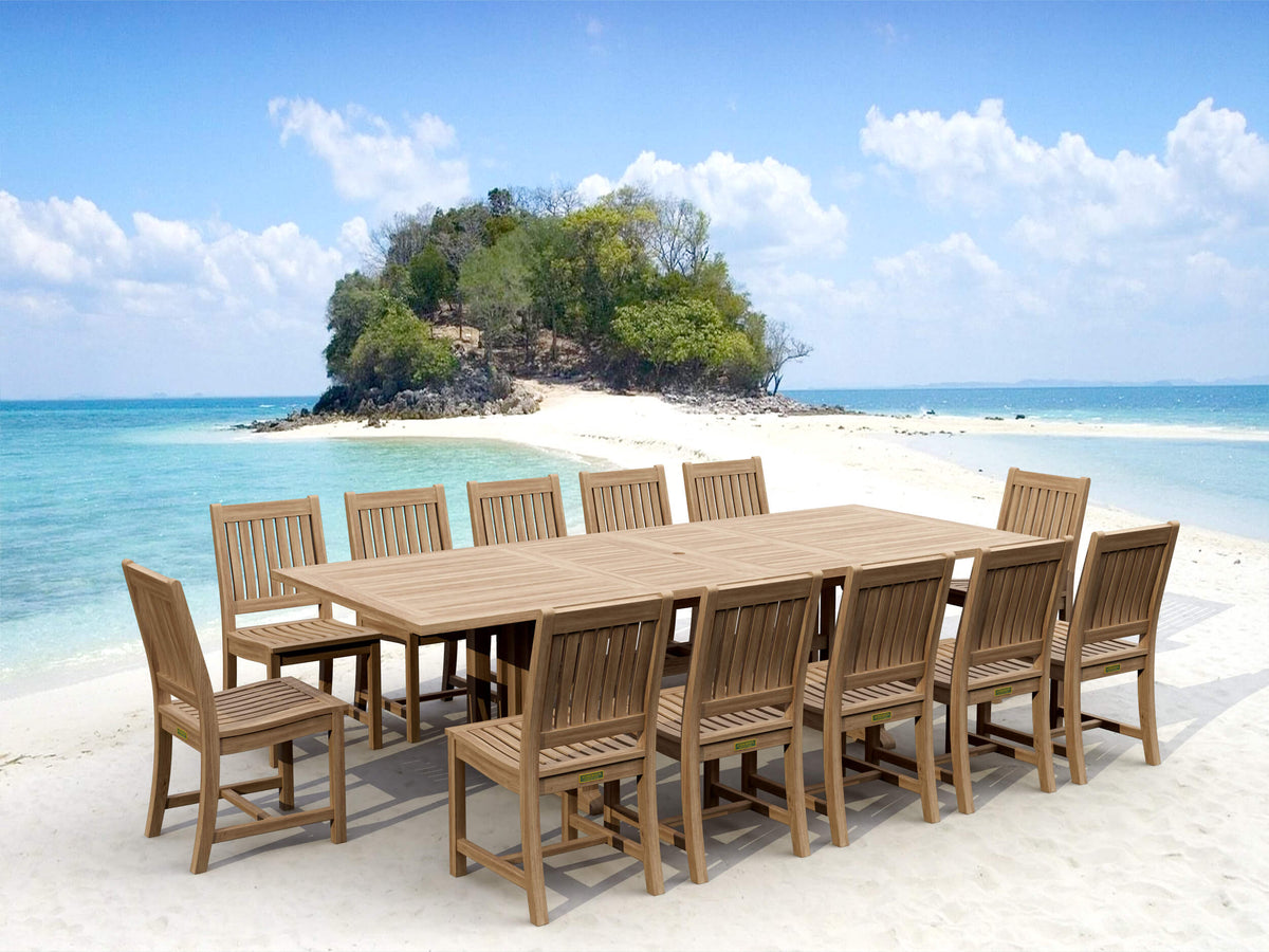 Wooden outdoor dining set on a sandy beach with turquoise water and a small island in the background.