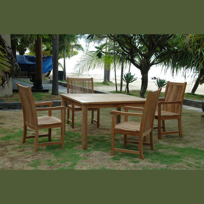 Wooden outdoor dining set with chairs on a grassy area near trees and a body of water.