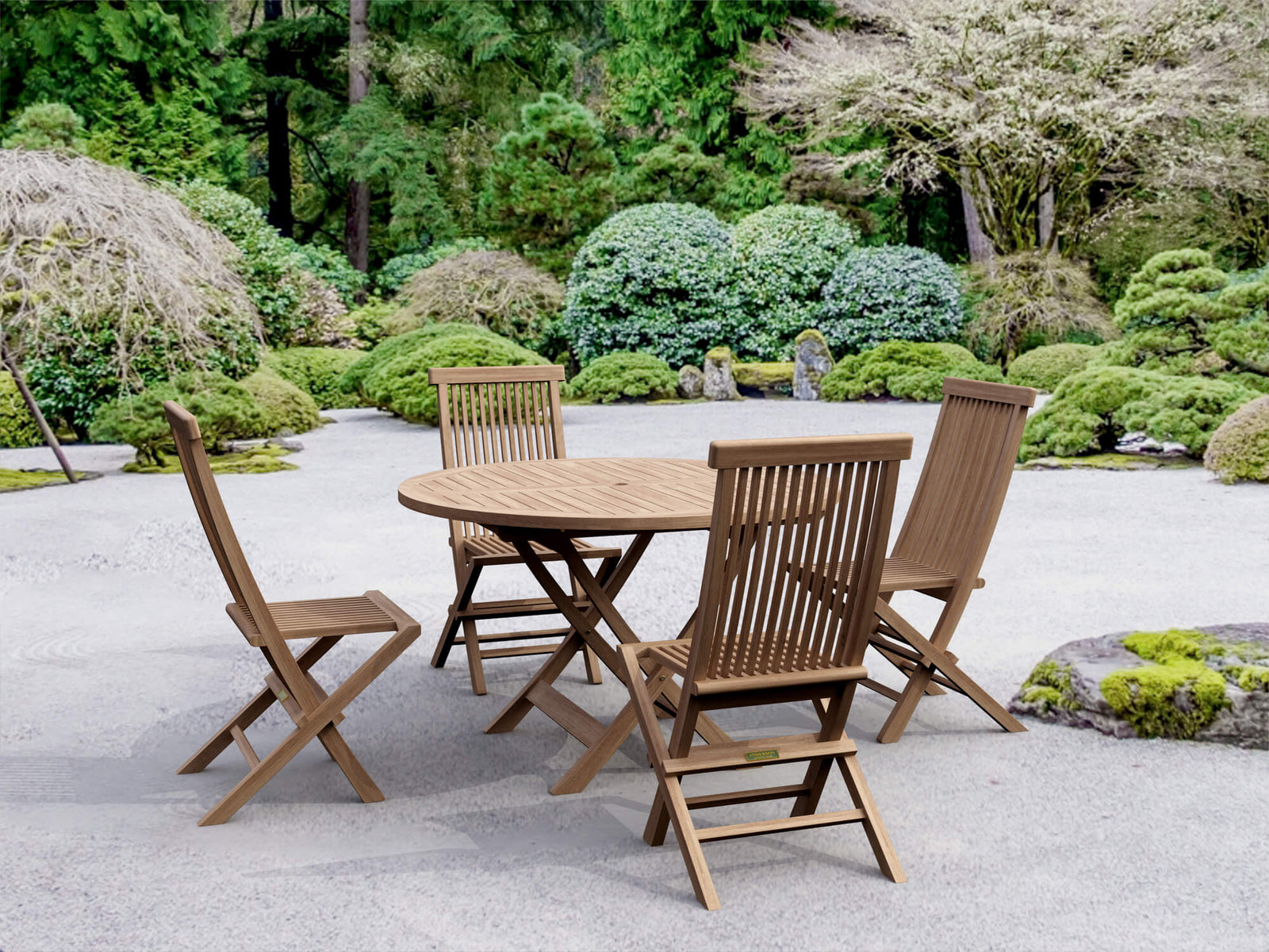 Wooden outdoor table and chairs set in a garden setting with greenery.
