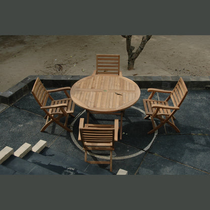 Wooden outdoor table and chairs on a stone patio