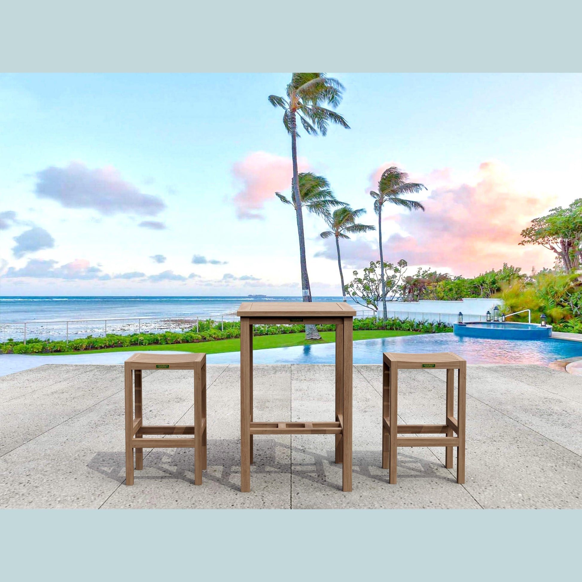 Outdoor furniture set with a table and two stools by a pool with palm trees and ocean view.