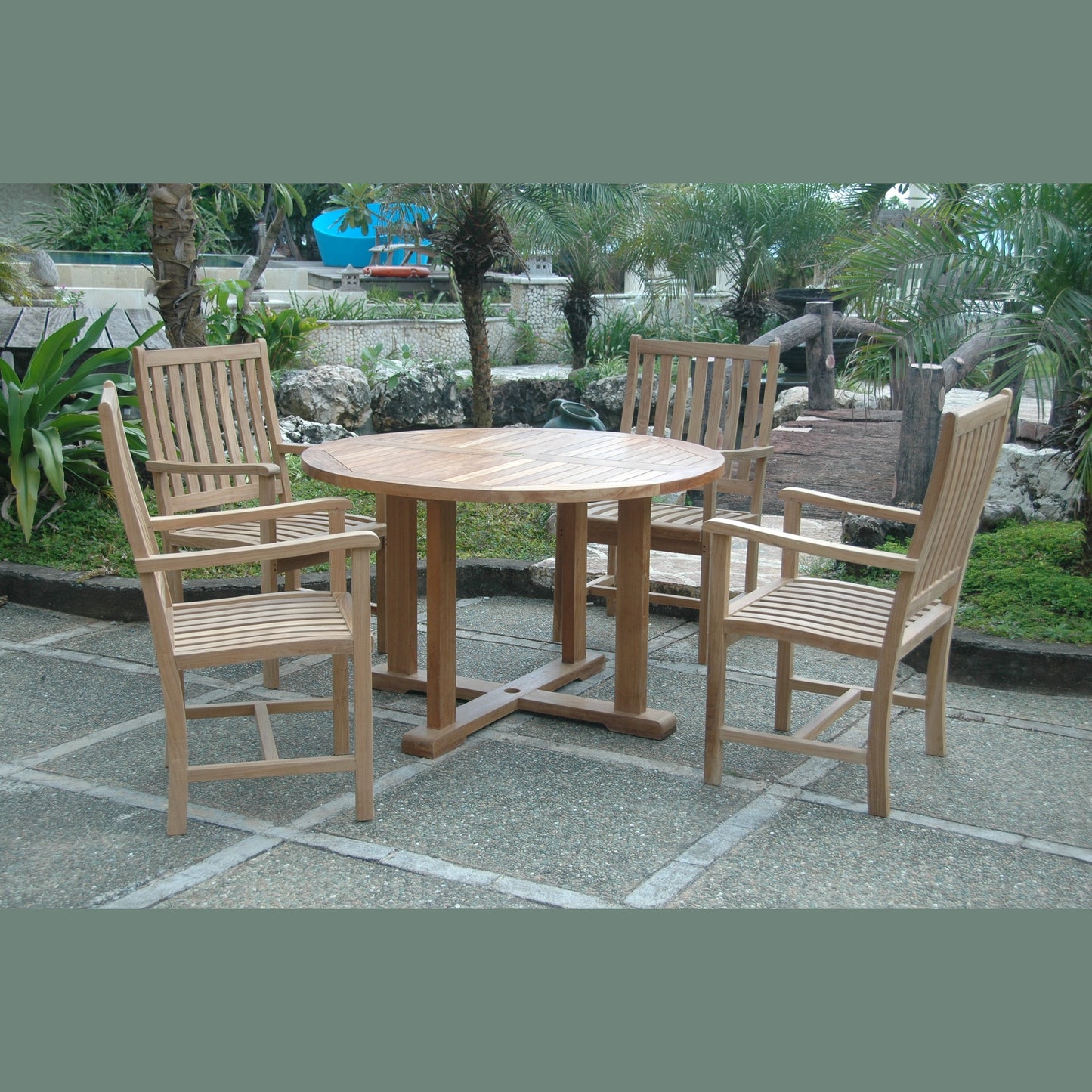 Wooden outdoor dining set with table and chairs on a stone patio