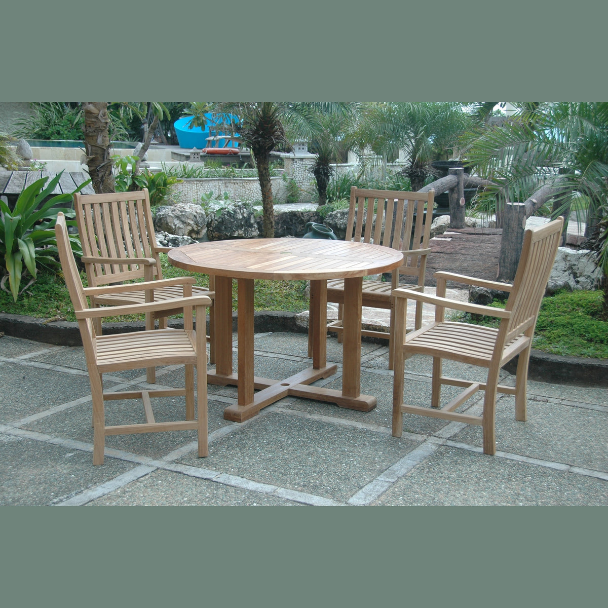 Wooden outdoor dining set with table and chairs on a stone patio