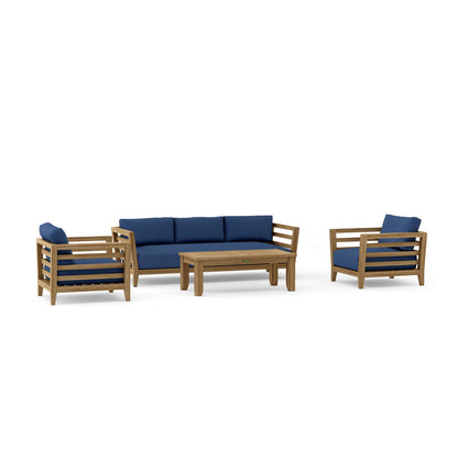 Outdoor furniture set with wooden frames and blue cushions on a white background