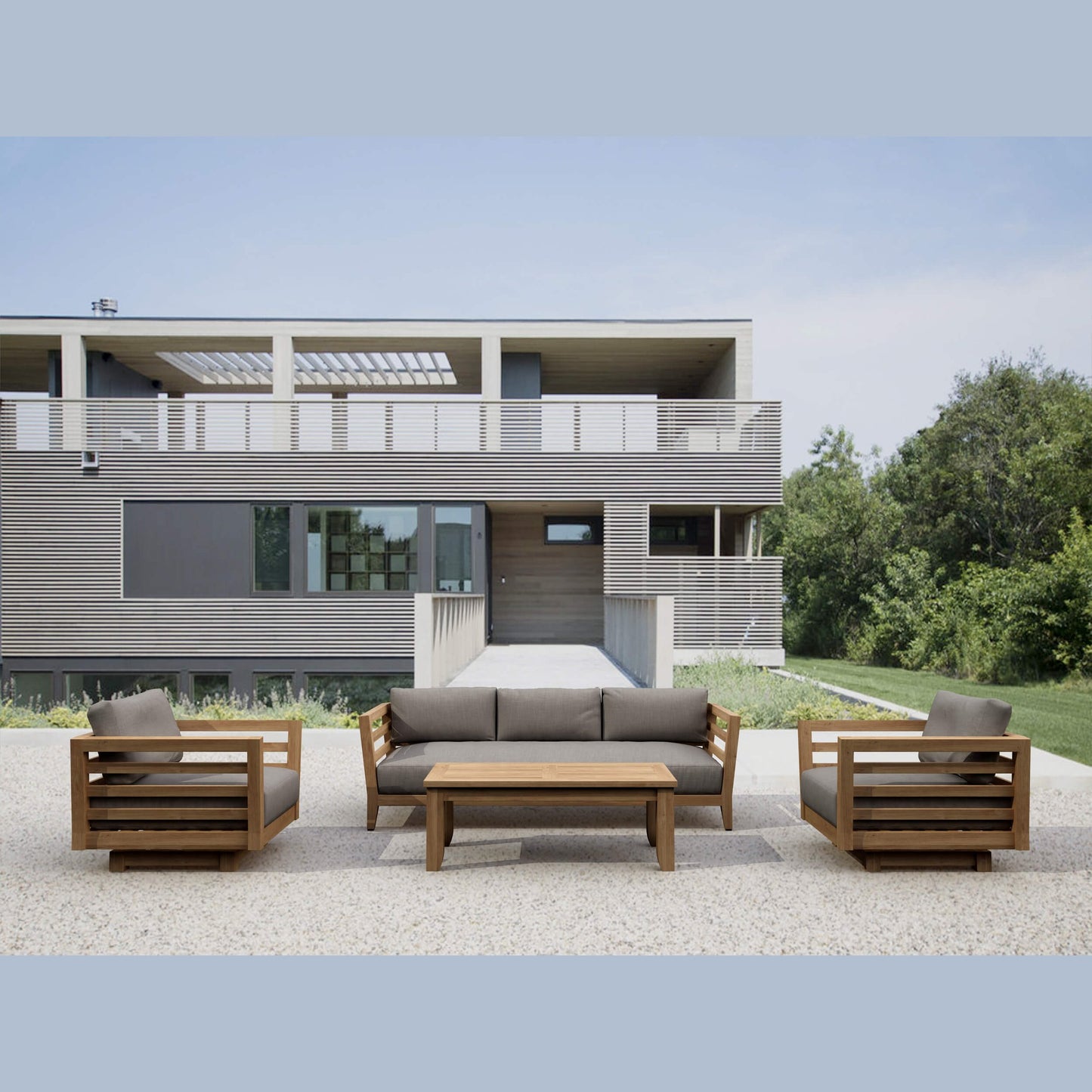 Modern outdoor furniture set in front of a contemporary house