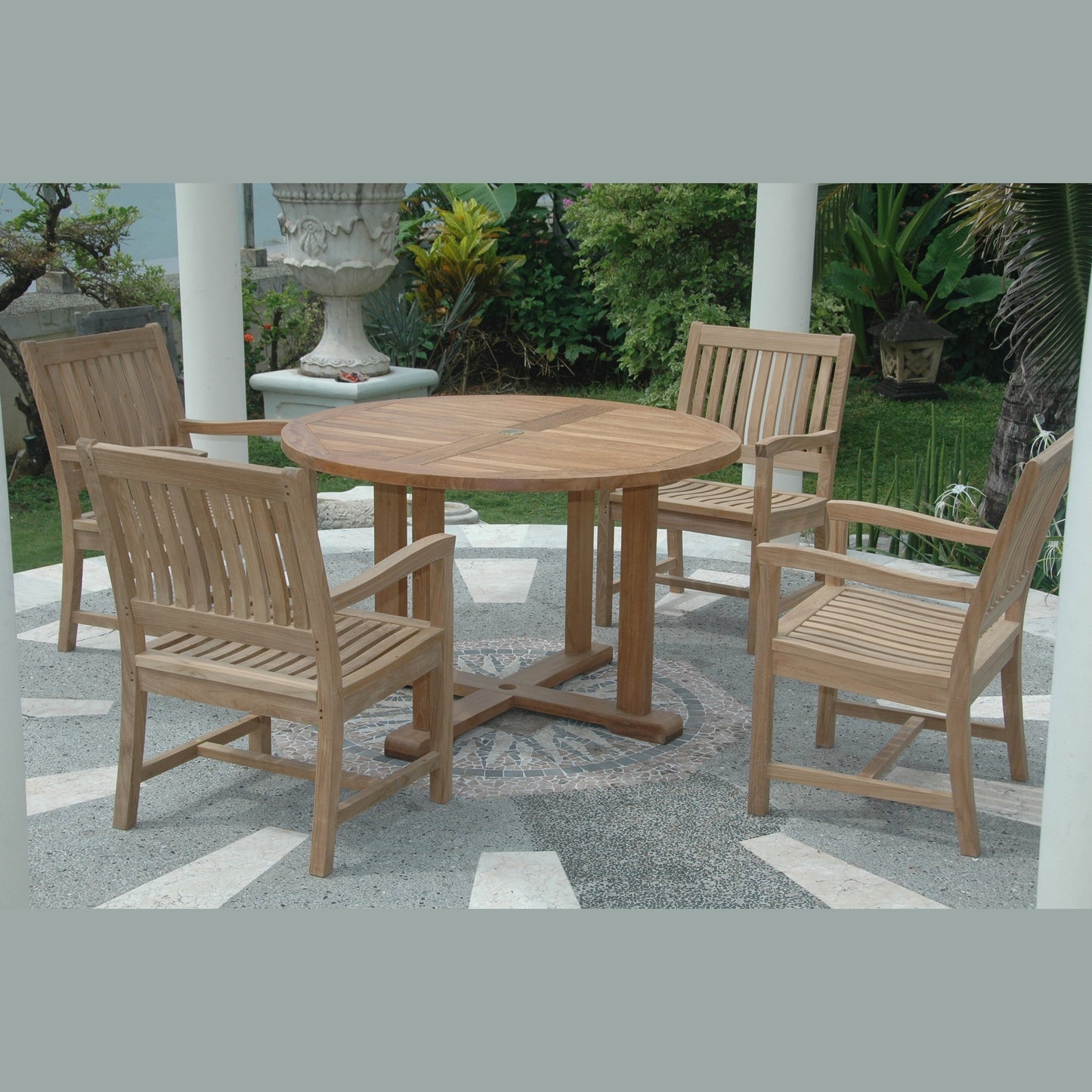 Wooden outdoor dining set with round table and chairs on a patio.