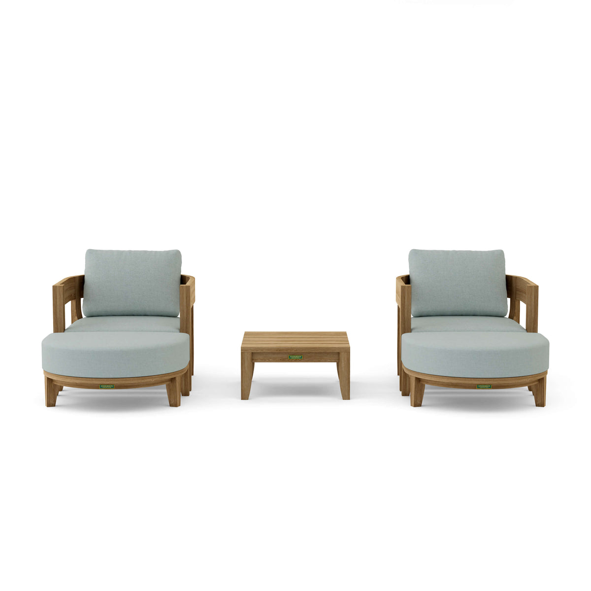 Two light gray cushioned chairs with a small wooden table on a white background