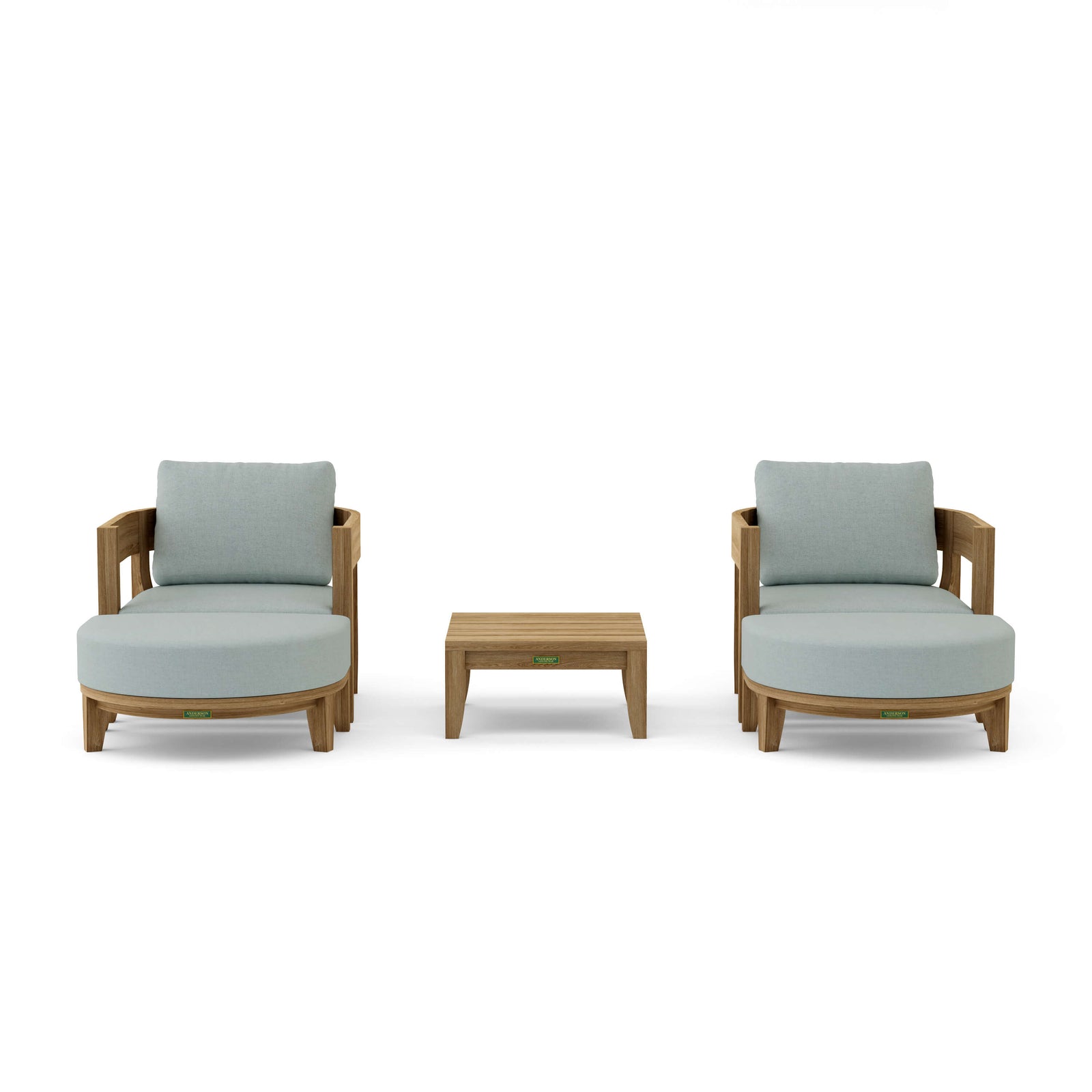 Two light gray cushioned chairs with a small wooden table on a white background