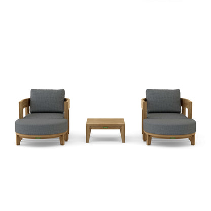 Two gray cushioned chairs with a small wooden table on a white background