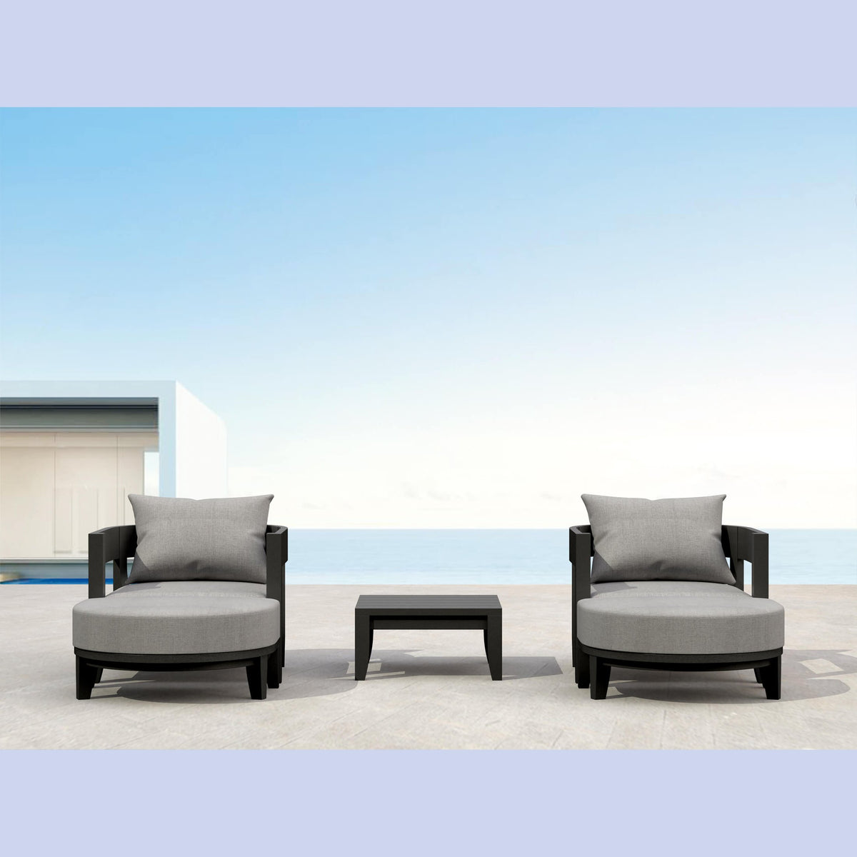 Outdoor furniture set with two chairs and a table on a patio with a clear blue sky.