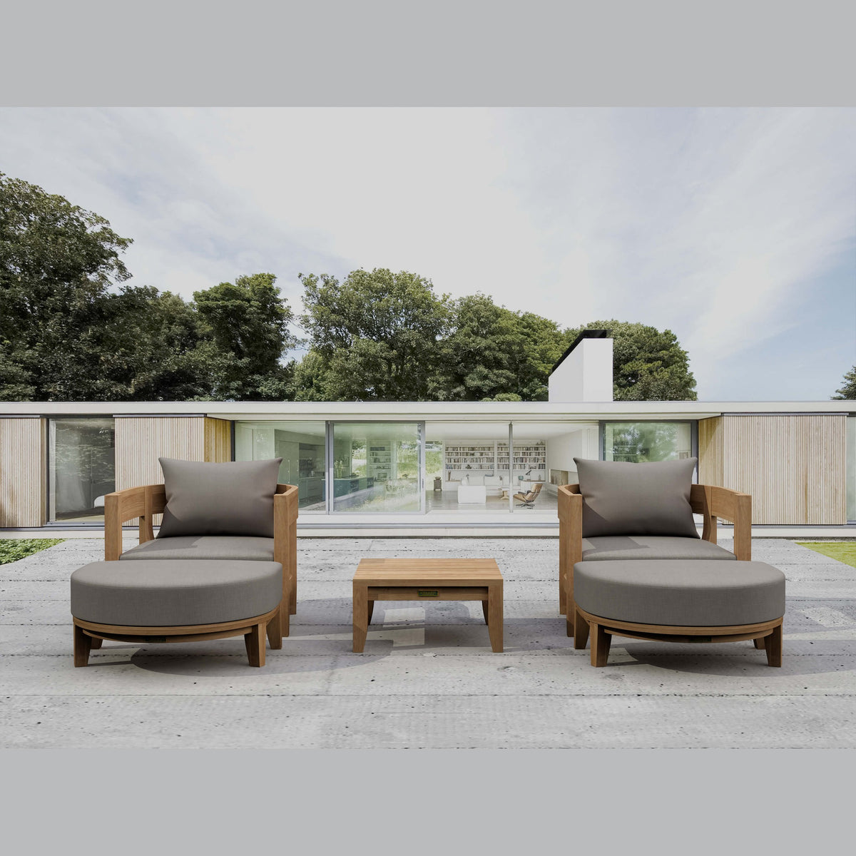 Outdoor patio furniture set with gray cushions on a wooden deck.