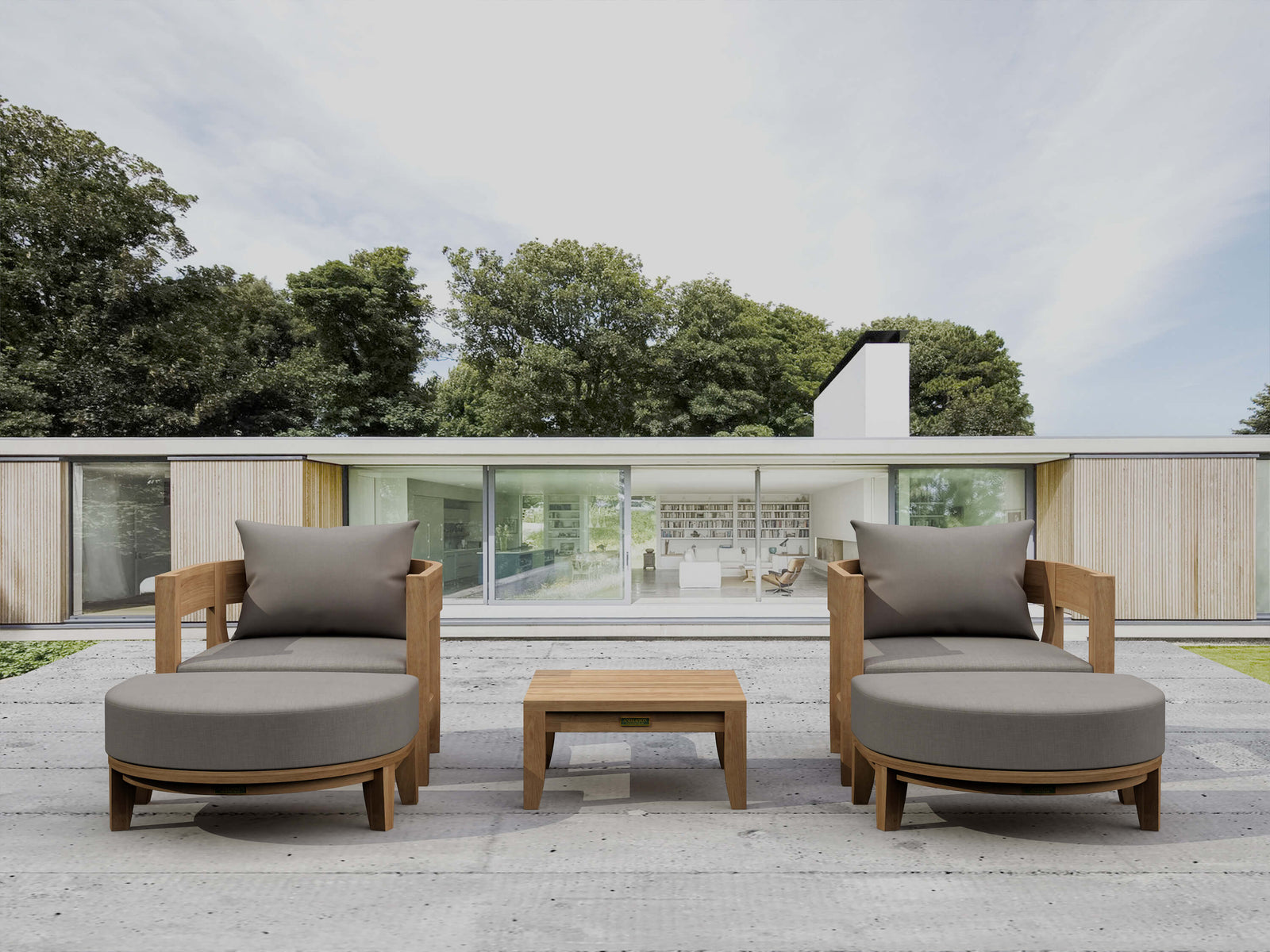 Outdoor patio furniture set with gray cushions on a wooden deck.