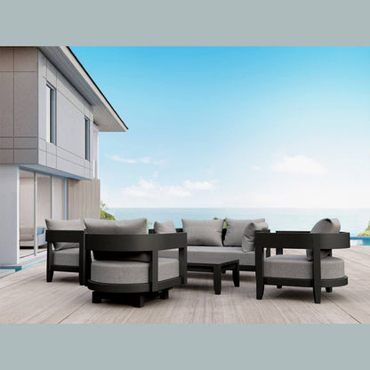 Outdoor patio furniture set with gray cushions on a wooden deck.