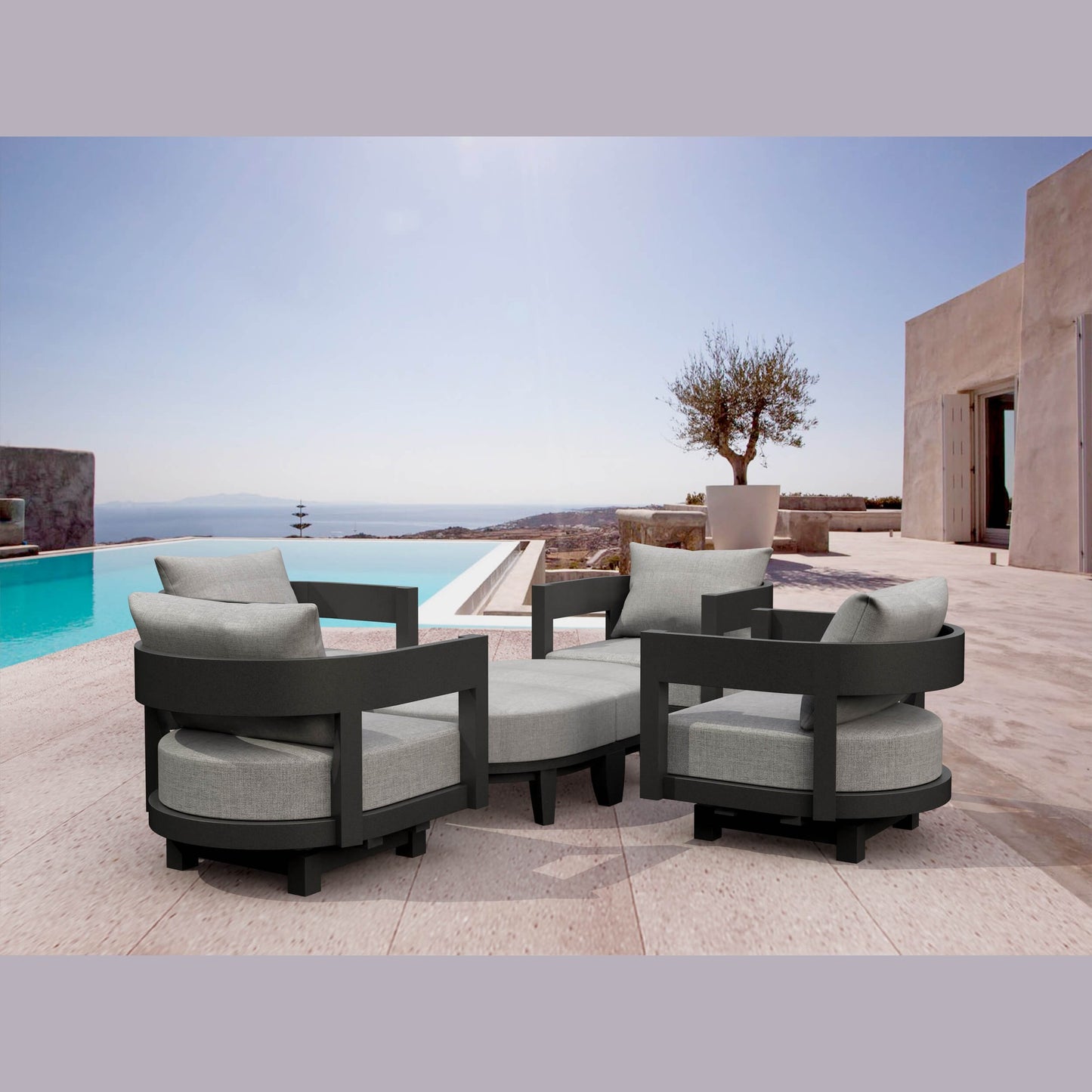 Outdoor patio furniture set with gray cushions by a poolside.