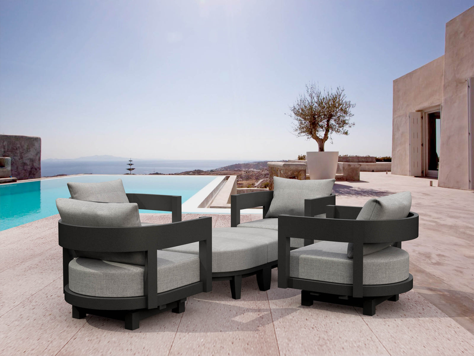 Outdoor patio furniture set with gray cushions by a poolside.