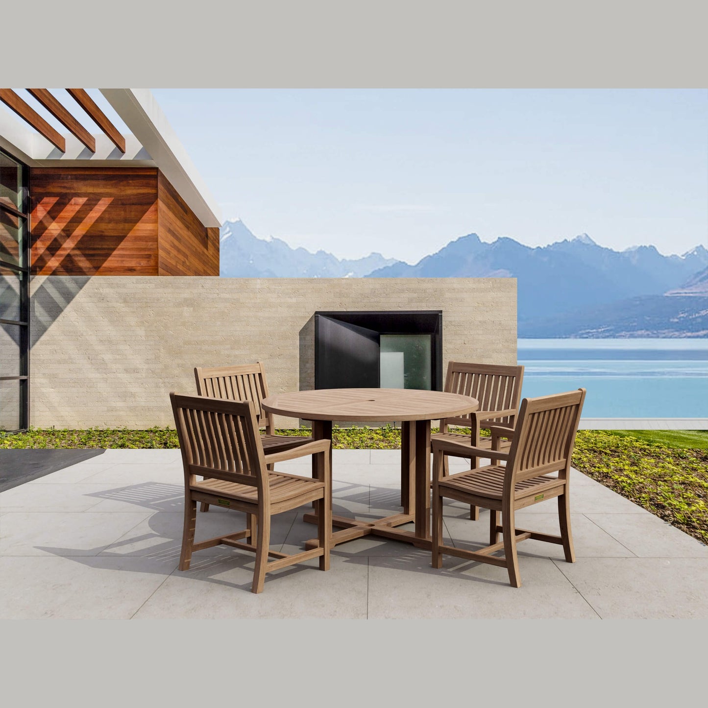 Wooden outdoor dining set with a scenic view of mountains and water.
