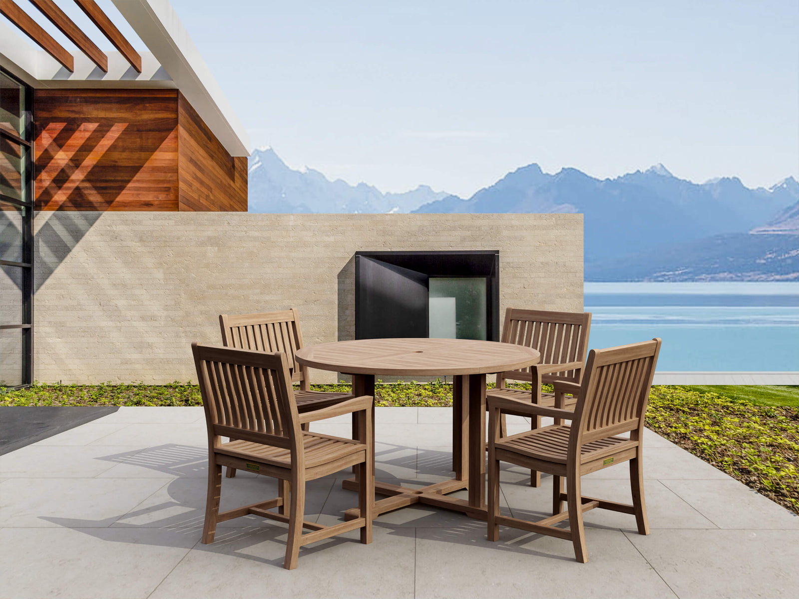 Wooden outdoor dining set with a scenic view of mountains and water.