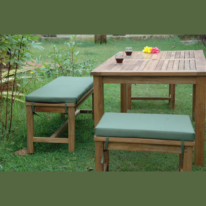 Wooden outdoor table with two matching benches on a grassy area