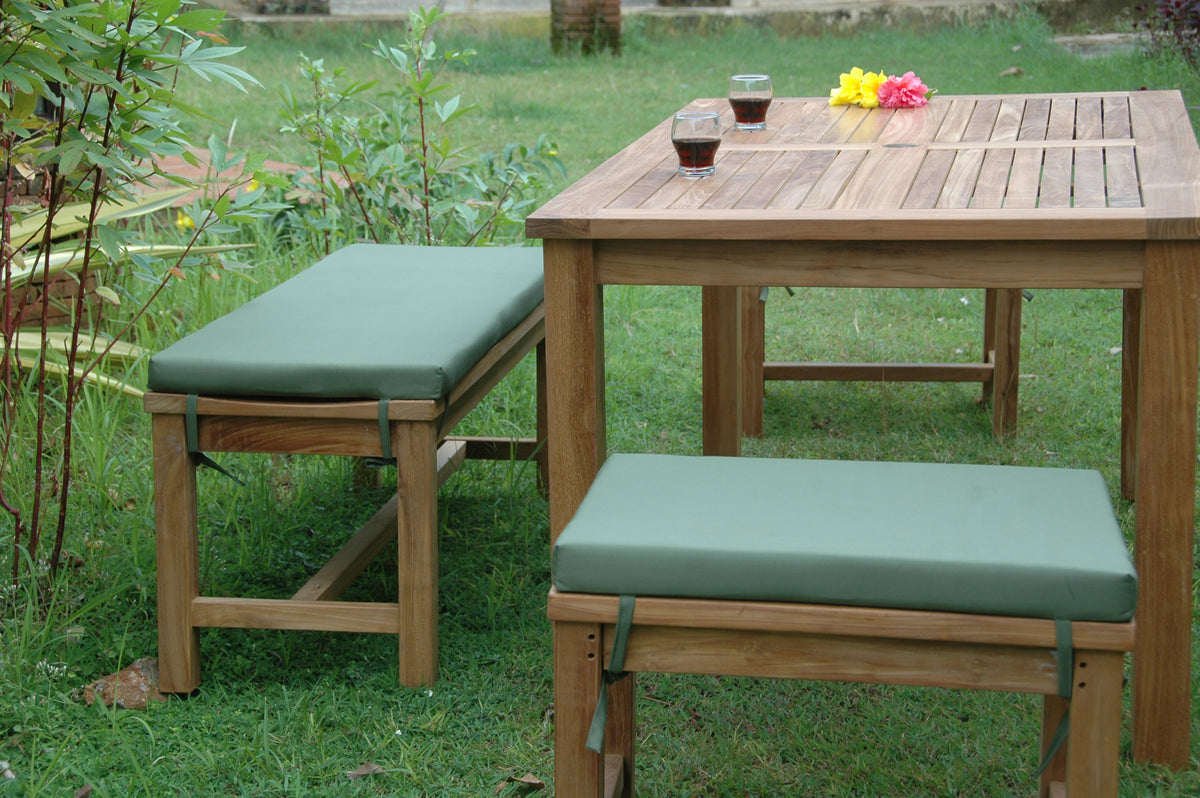 Wooden outdoor table with two matching benches on a grassy area