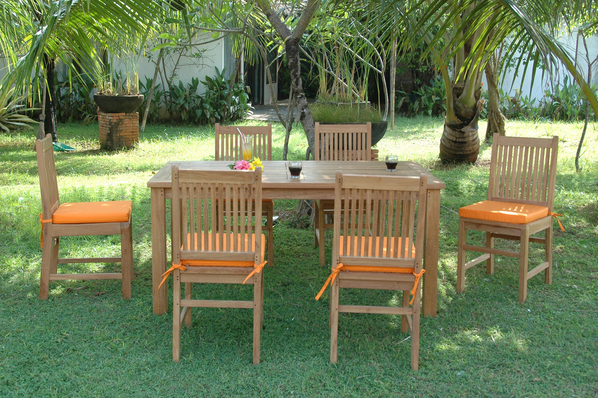 Outdoor dining set with wooden table and chairs on grass
