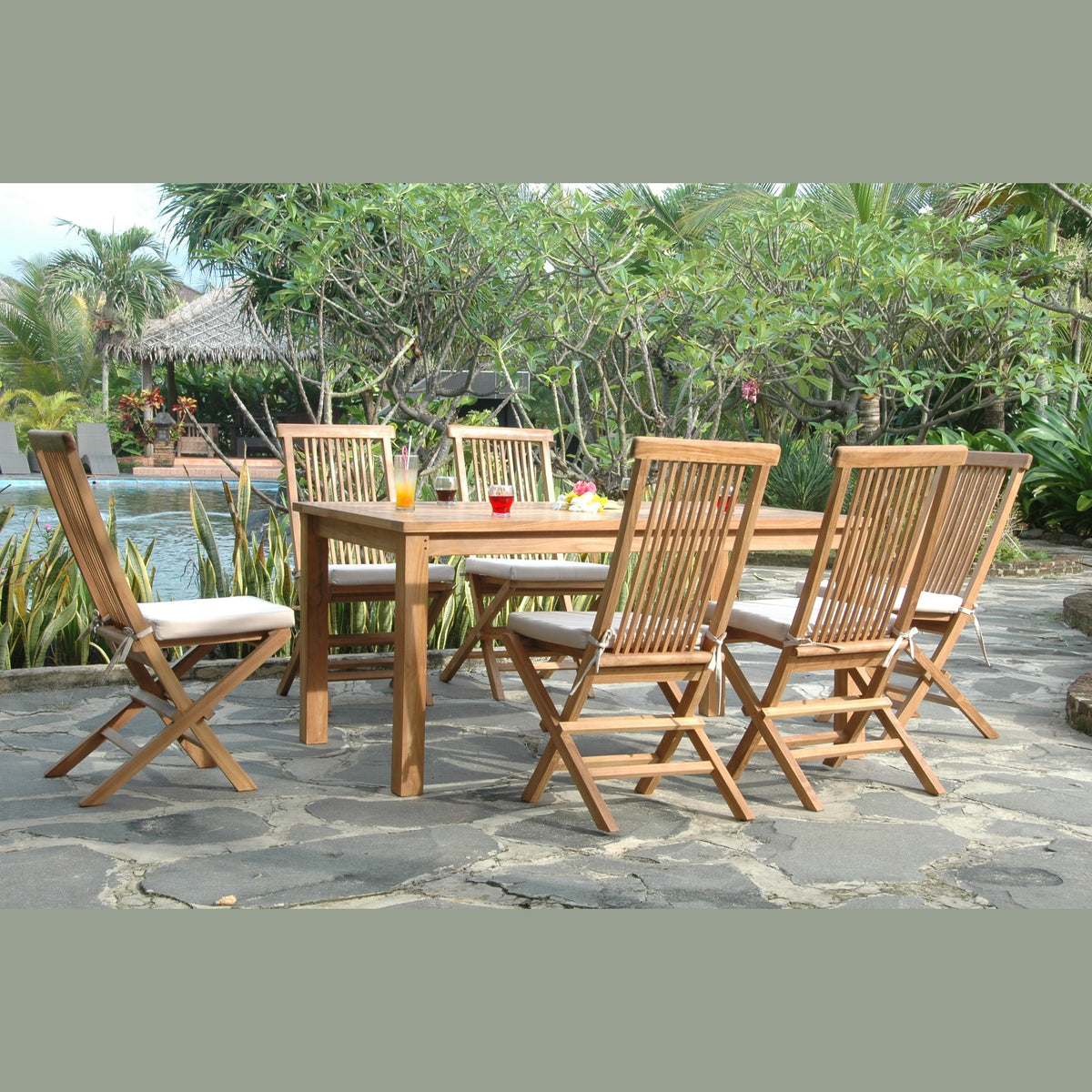 Wooden outdoor dining set with chairs and table on a stone patio