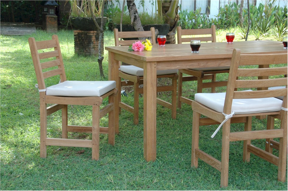 Wooden outdoor dining set with chairs and table on grass