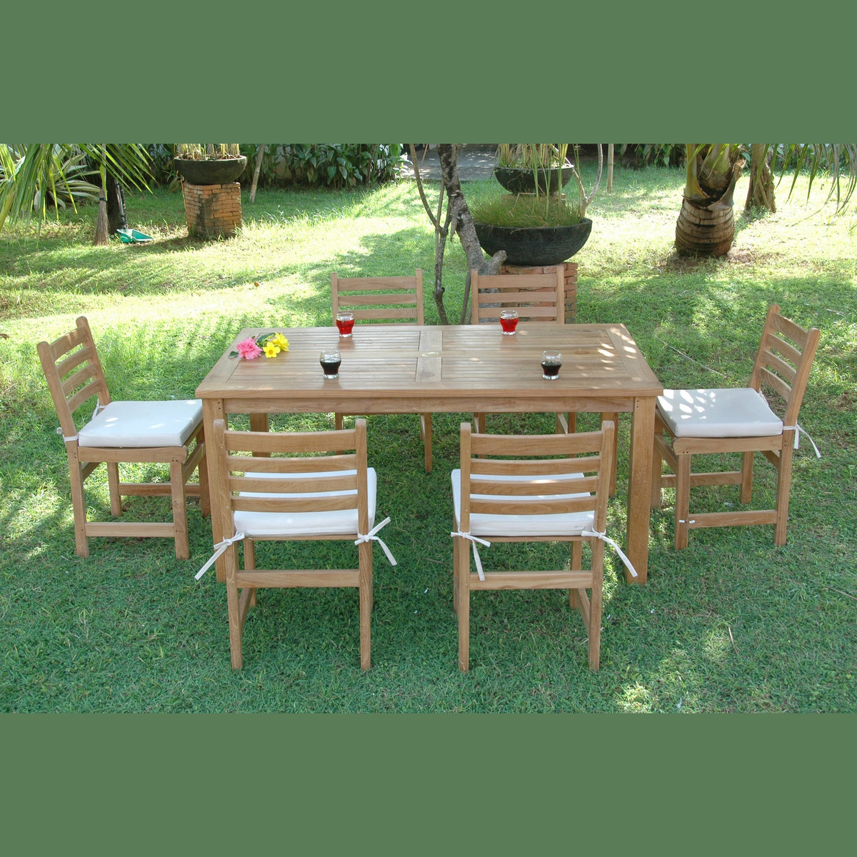 Wooden outdoor dining set with chairs and table on grass