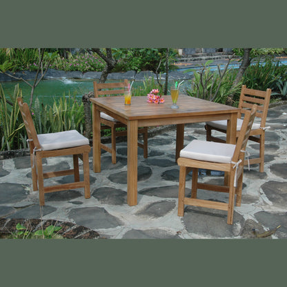 Outdoor dining set with wooden table and chairs on a stone patio