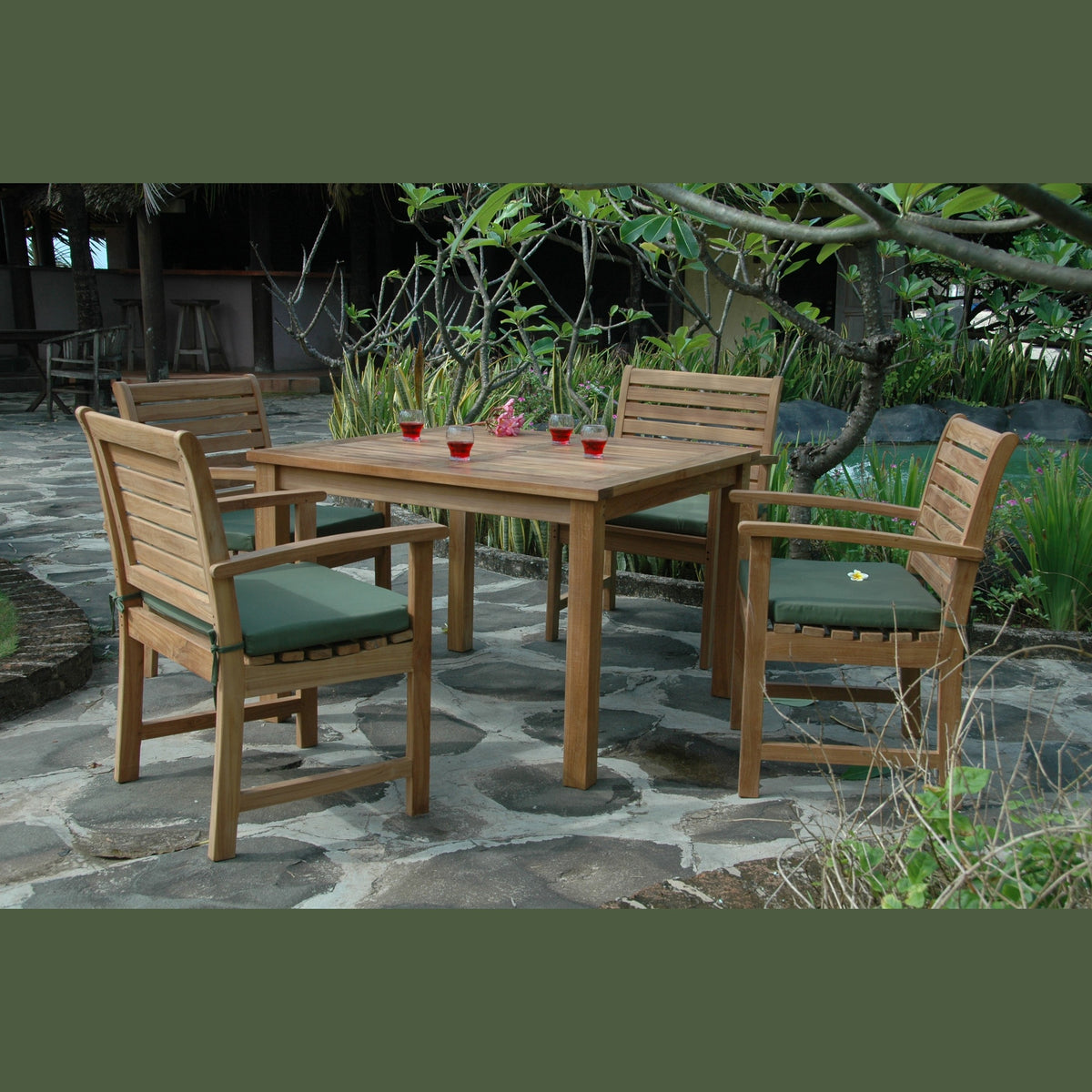 Wooden outdoor dining set with chairs and table on a stone patio