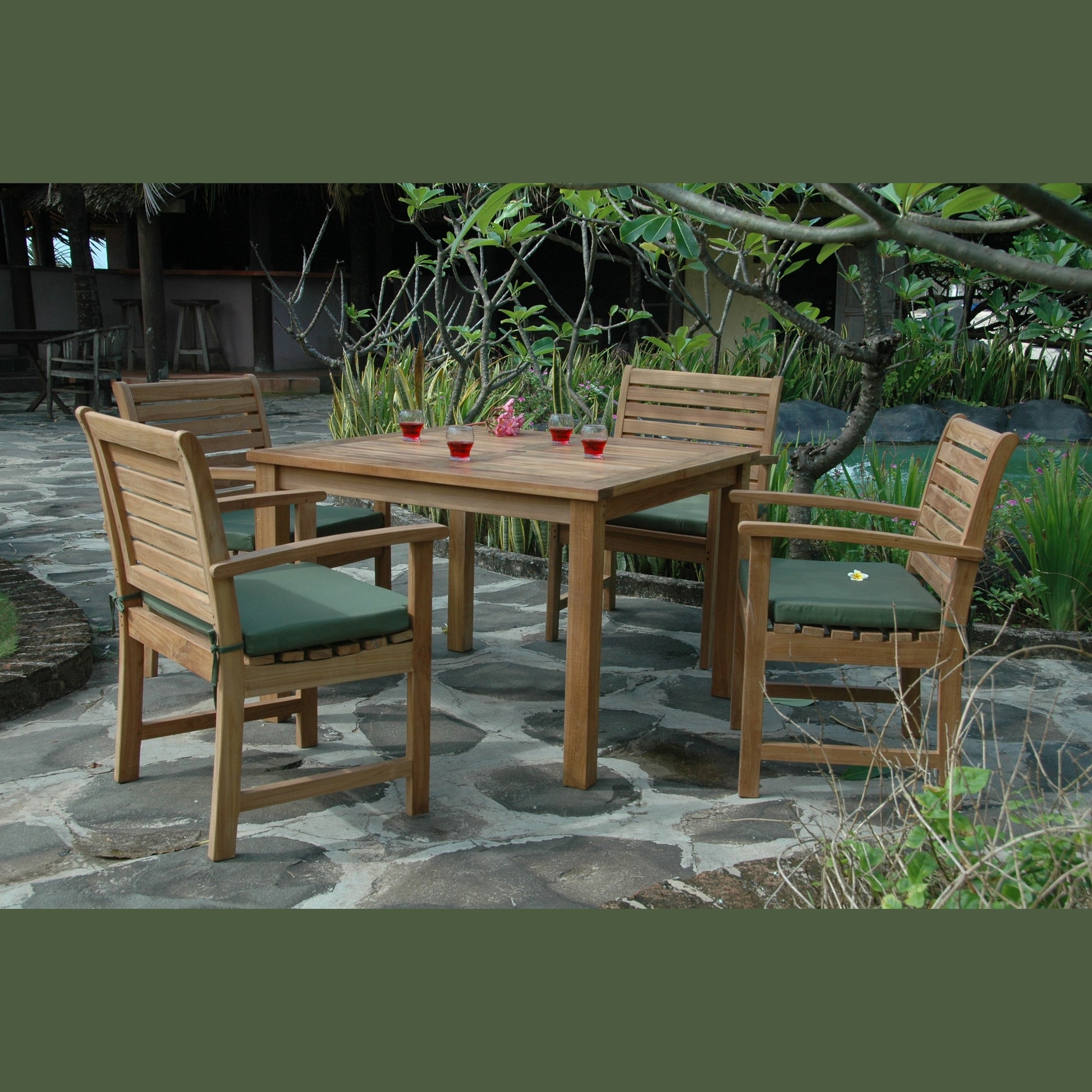 Wooden outdoor dining set with chairs and table on a stone patio