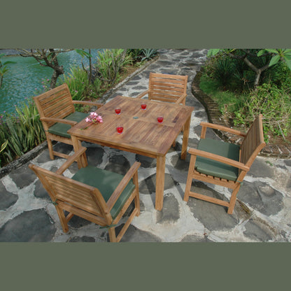 Wooden outdoor furniture set with table and chairs on a stone patio near a body of water.