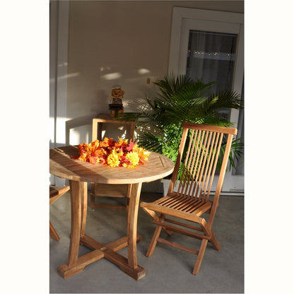 Wooden table with a chair and decorative flowers on a patio