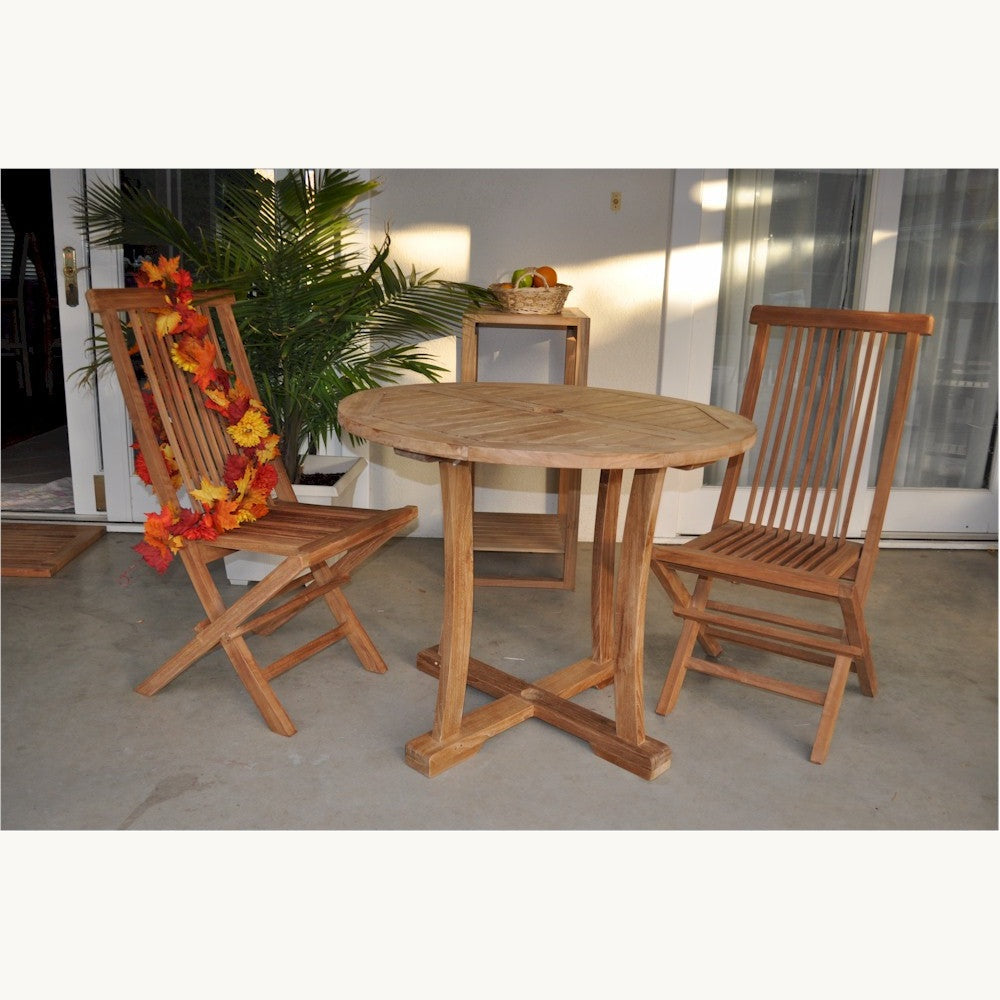 Wooden outdoor table with two chairs on a patio