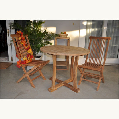 Wooden outdoor table with two chairs on a patio