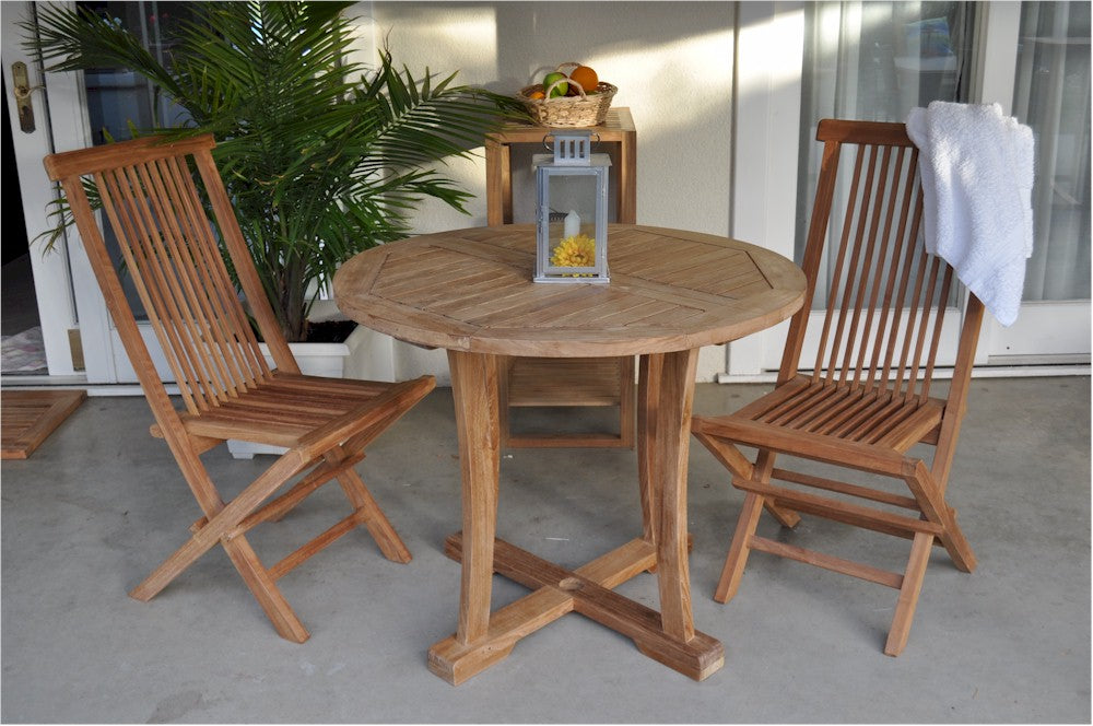 Wooden outdoor table with chairs on a patio