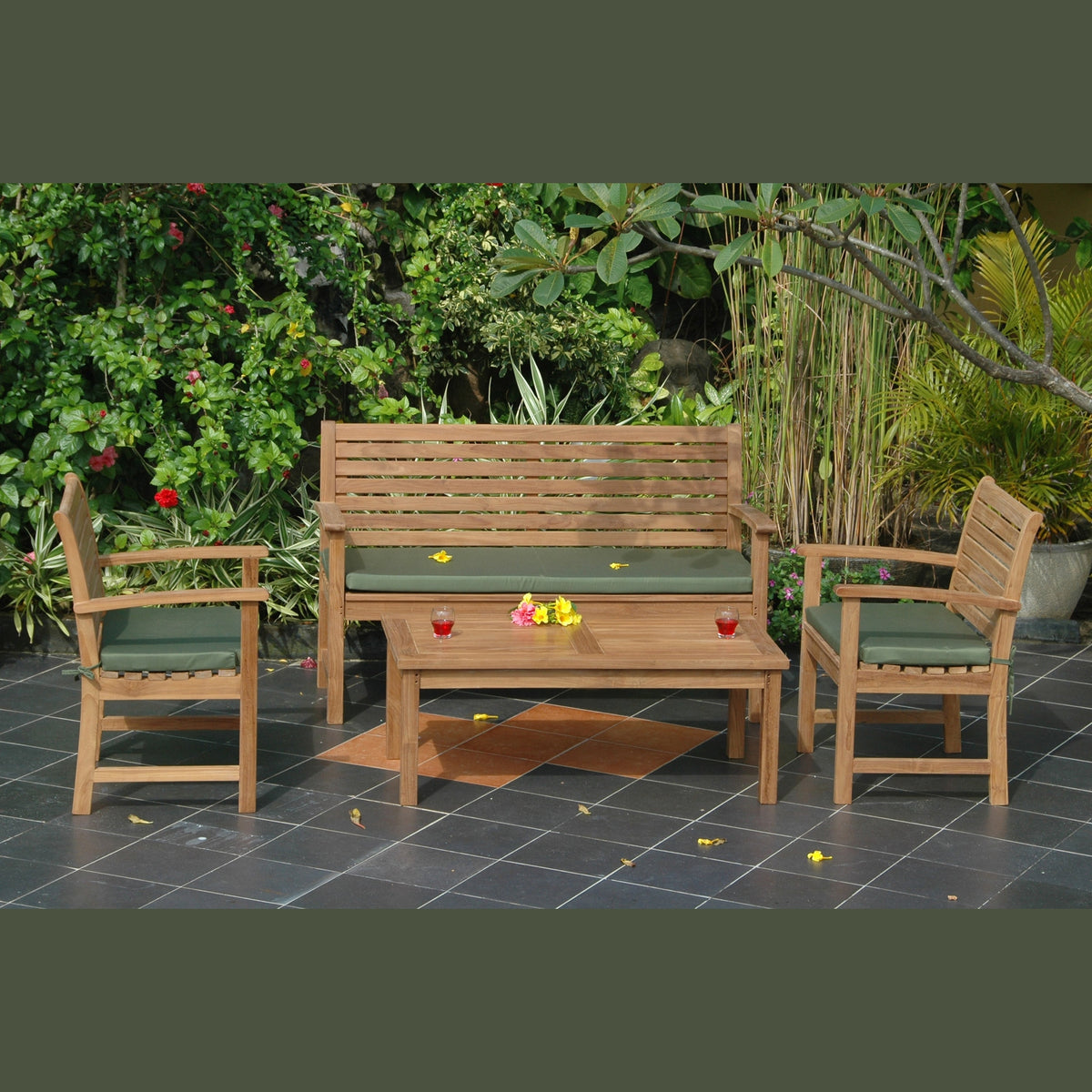 Wooden outdoor furniture set with green cushions on a patio