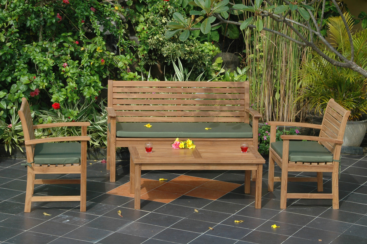 Wooden outdoor furniture set with green cushions on a patio