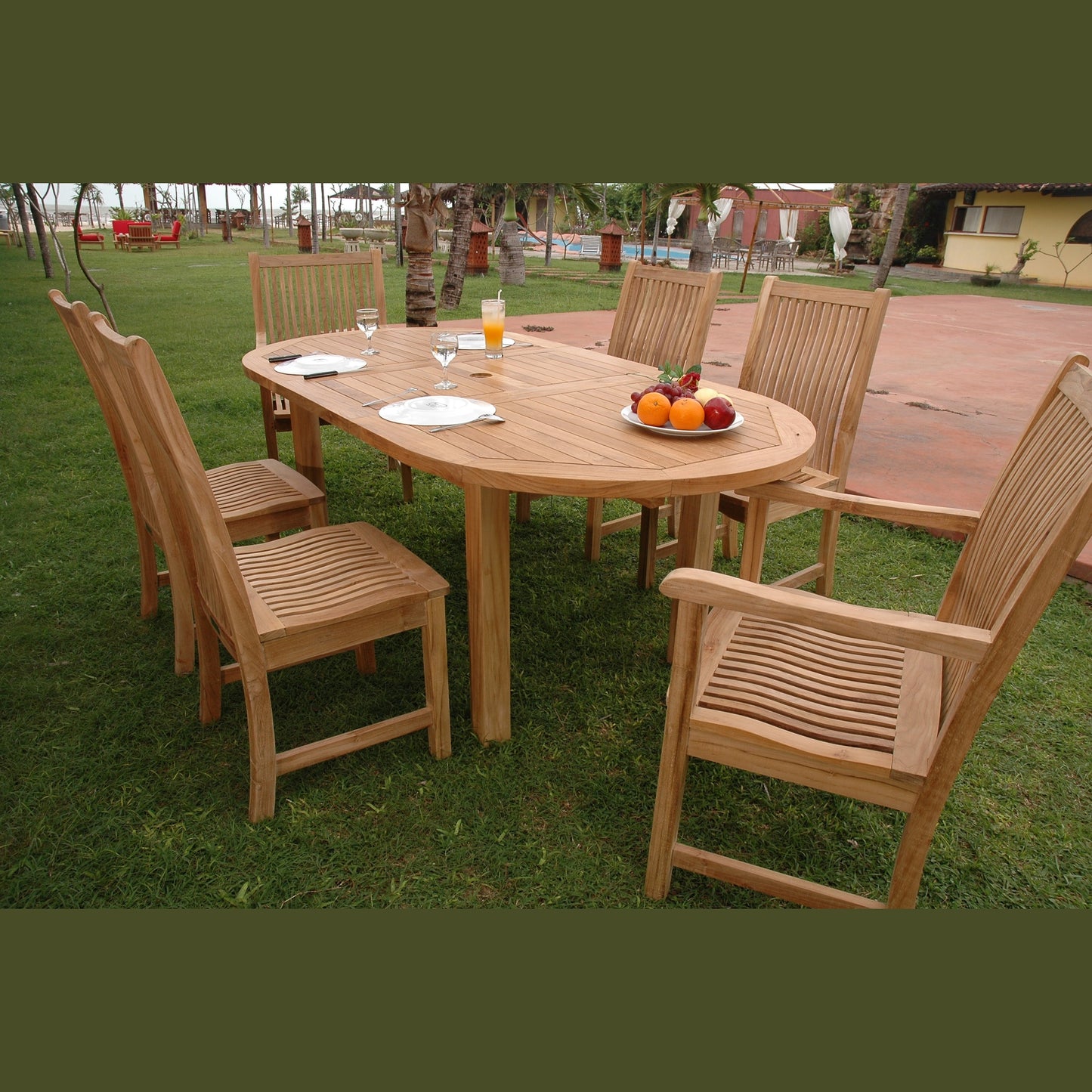 Wooden outdoor dining set with a table and chairs on grass
