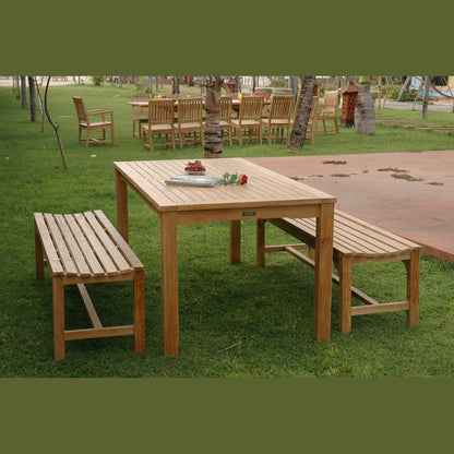Wooden outdoor table with benches on a grassy area