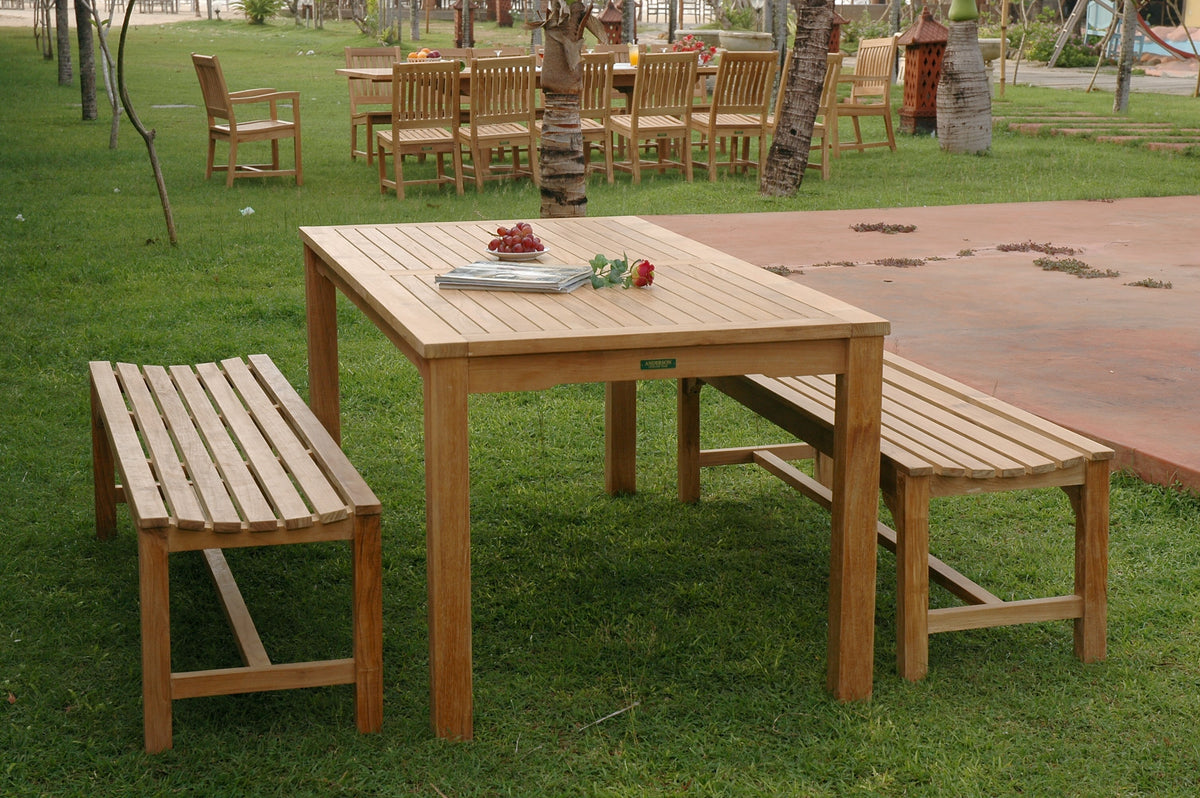Wooden outdoor table with benches on a grassy area