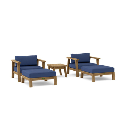 Outdoor furniture set with blue cushions on a white background